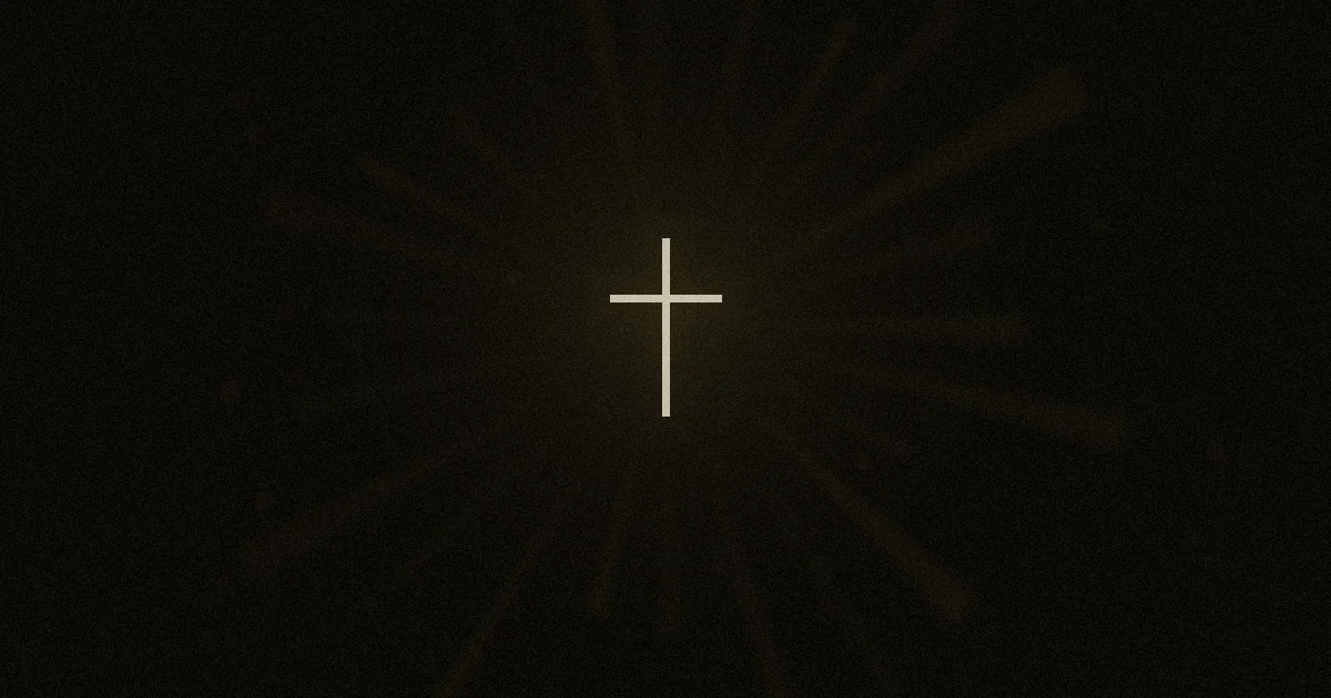 A luminous cross surrounded by candlelight